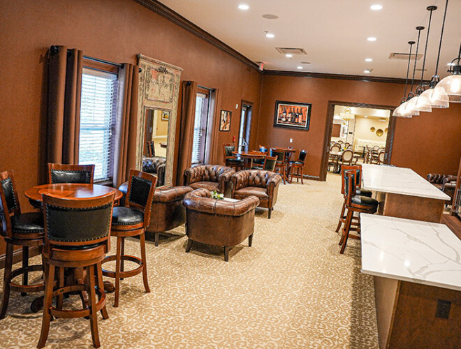 Traditions at Camargos bar showing all the different areas to sit and the dining room in the background.